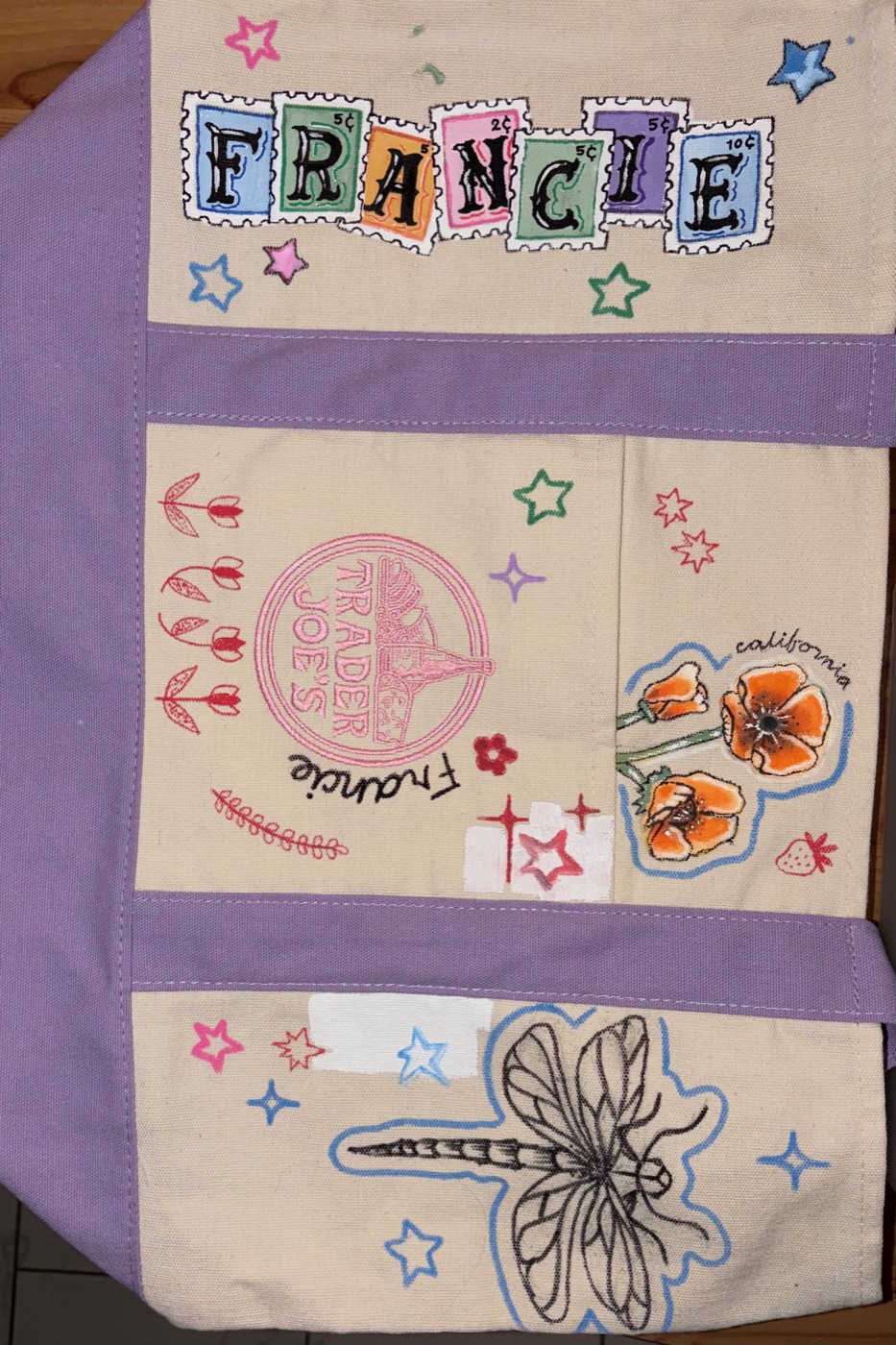 Hand-painted canvas tote with FRANCIE in postage-stamp lettering, a custom Trader Joe's redraw, California poppies, and ink illustrations